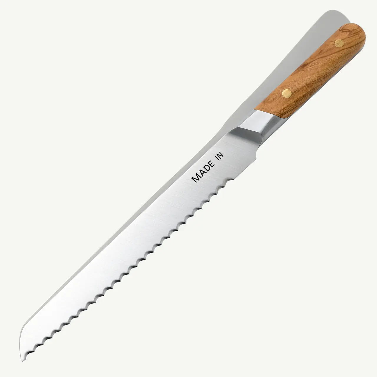 A serrated knife with a wooden handle marked with "MADE IN."